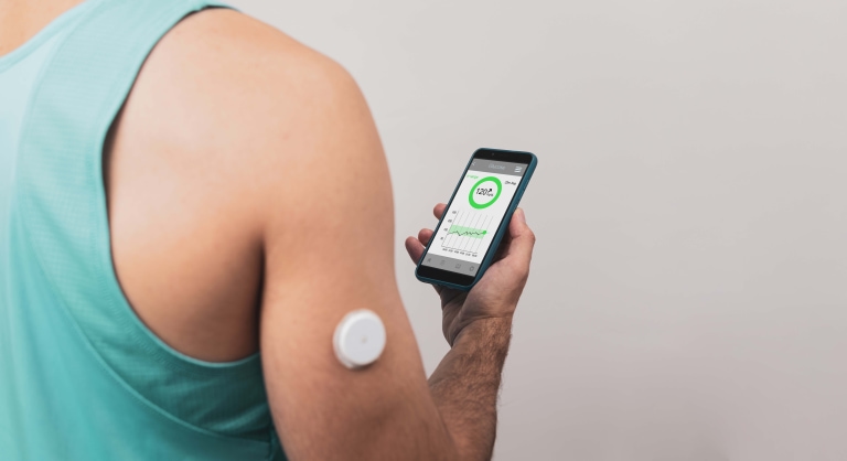 a person using a device to check the blood pressure