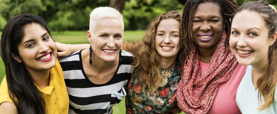 a group of women smiling