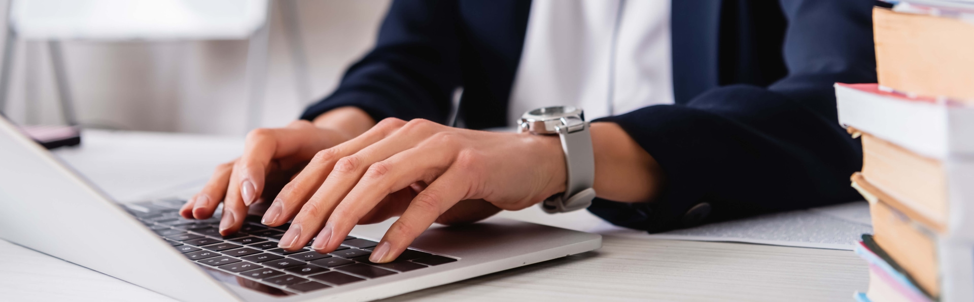 a person typing on a laptop