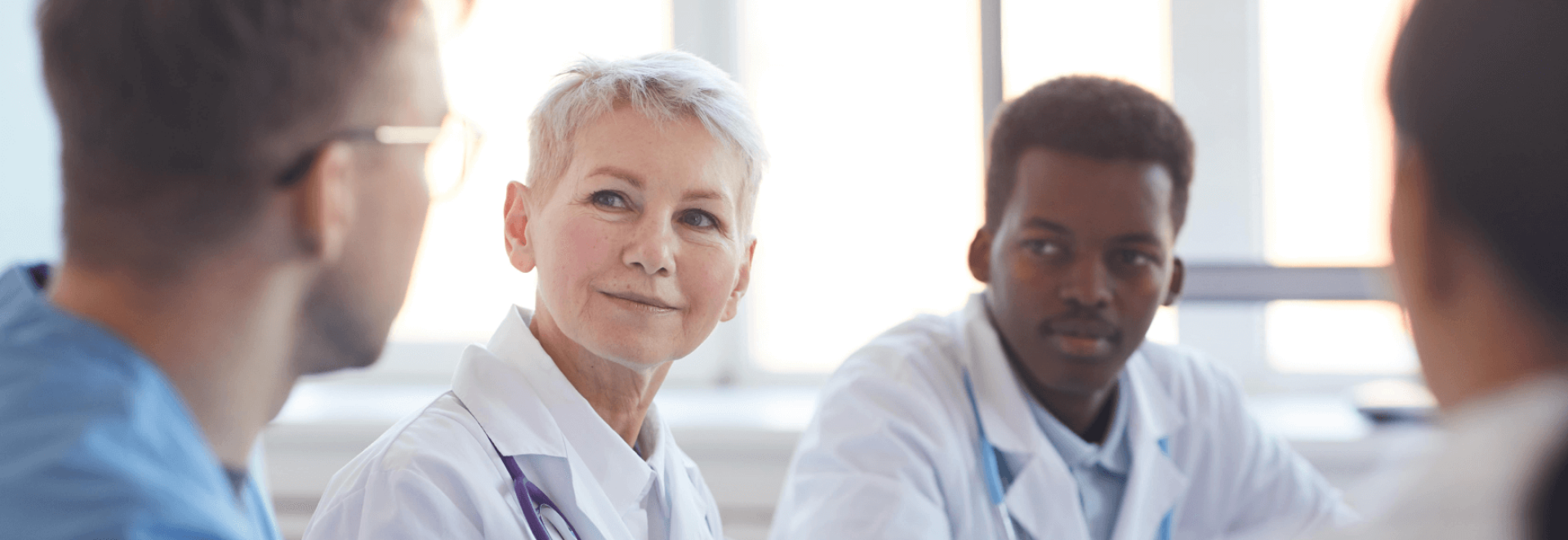 a woman and a man in white coats