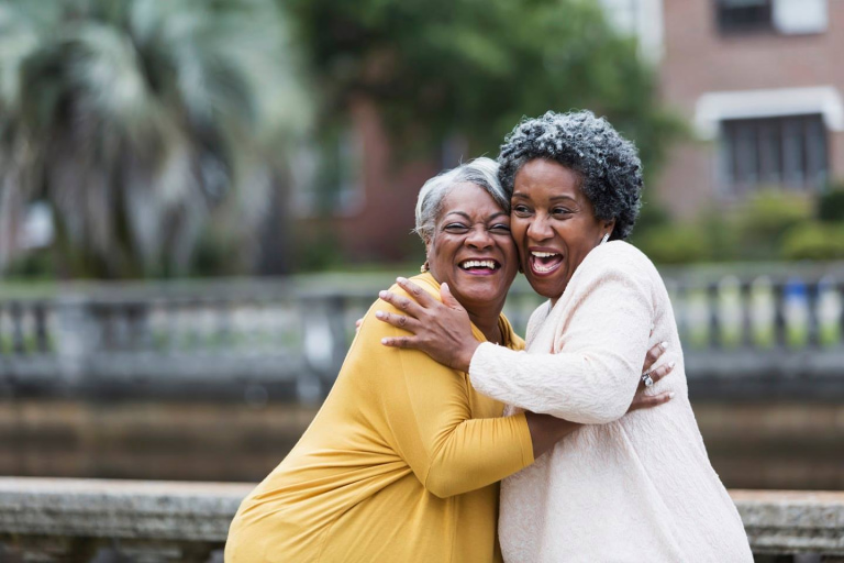 two women hugging each other