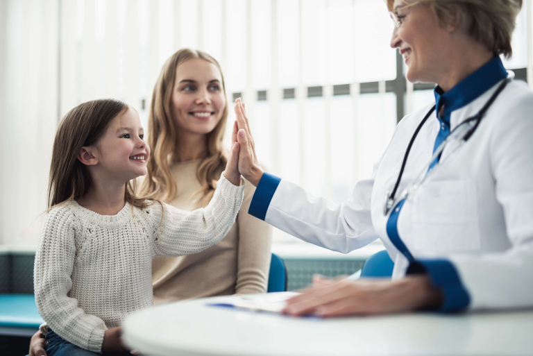 a person giving a high five to a child