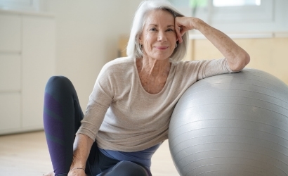 woman sitting with a ball