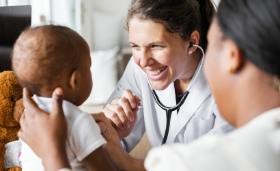 doctor checking an infant