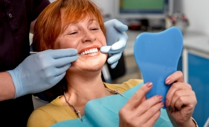 woman getting her teeth checked