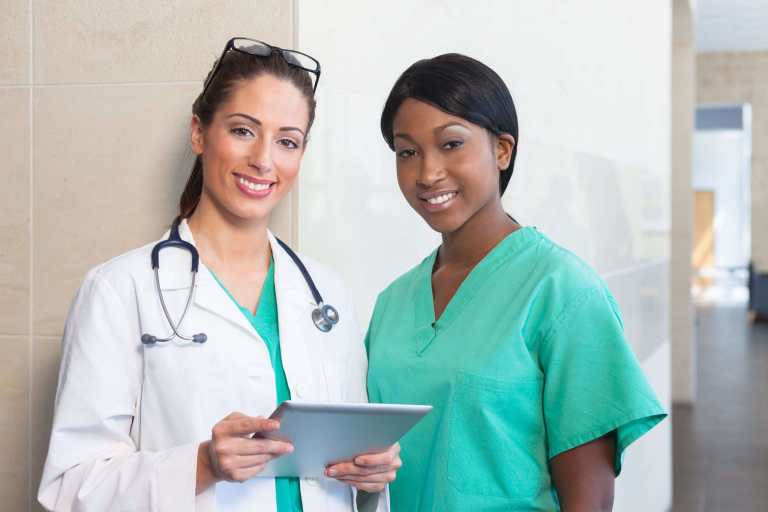 medium shot of women wearing scrubs